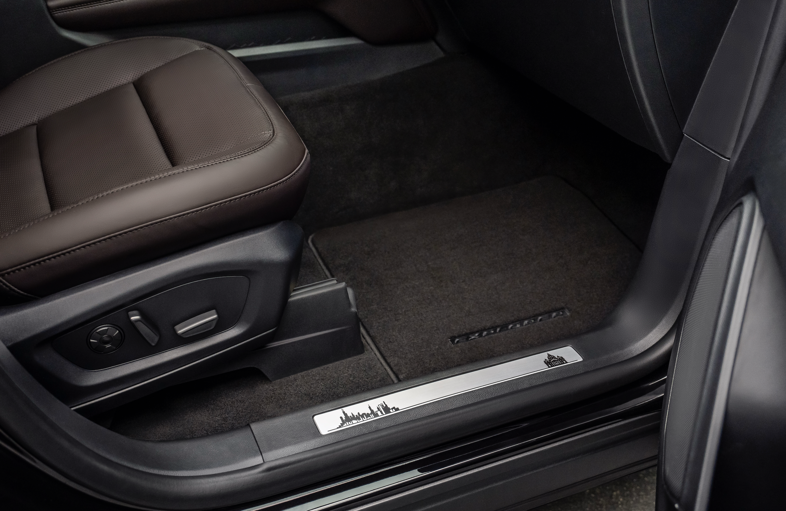 Engravings of Chicago’s skyline and St. Peter’s Basilica appear on the scuff plates of the custom Ford Explorer built for Pope Leo XIV. | Credit: Photo courtesy of Ford