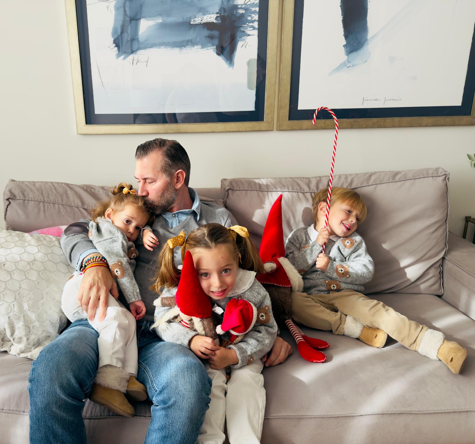 Miguel with his three children. | Credit: Photo courtesy of Virginia Pérez de Santana