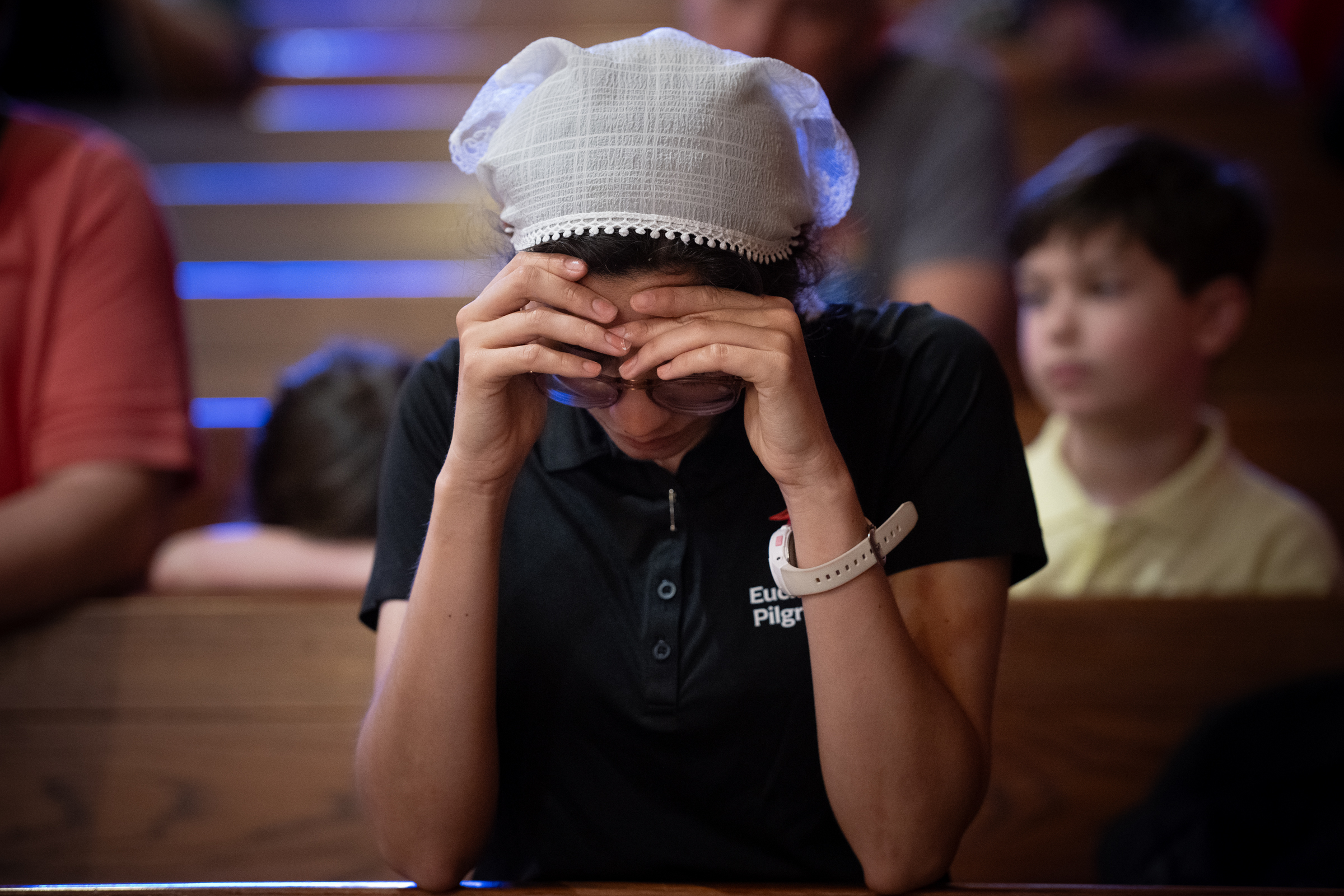 National Eucharistic Pilgrimage perpetual pilgrim Mary Carmen Zakrajsek prays inside St. Francis Xavier Church in Brunswick, Georgia, during events connected to the Georgia Martyrs on May 26, 2026. | Credit: Jeffrey Bruno