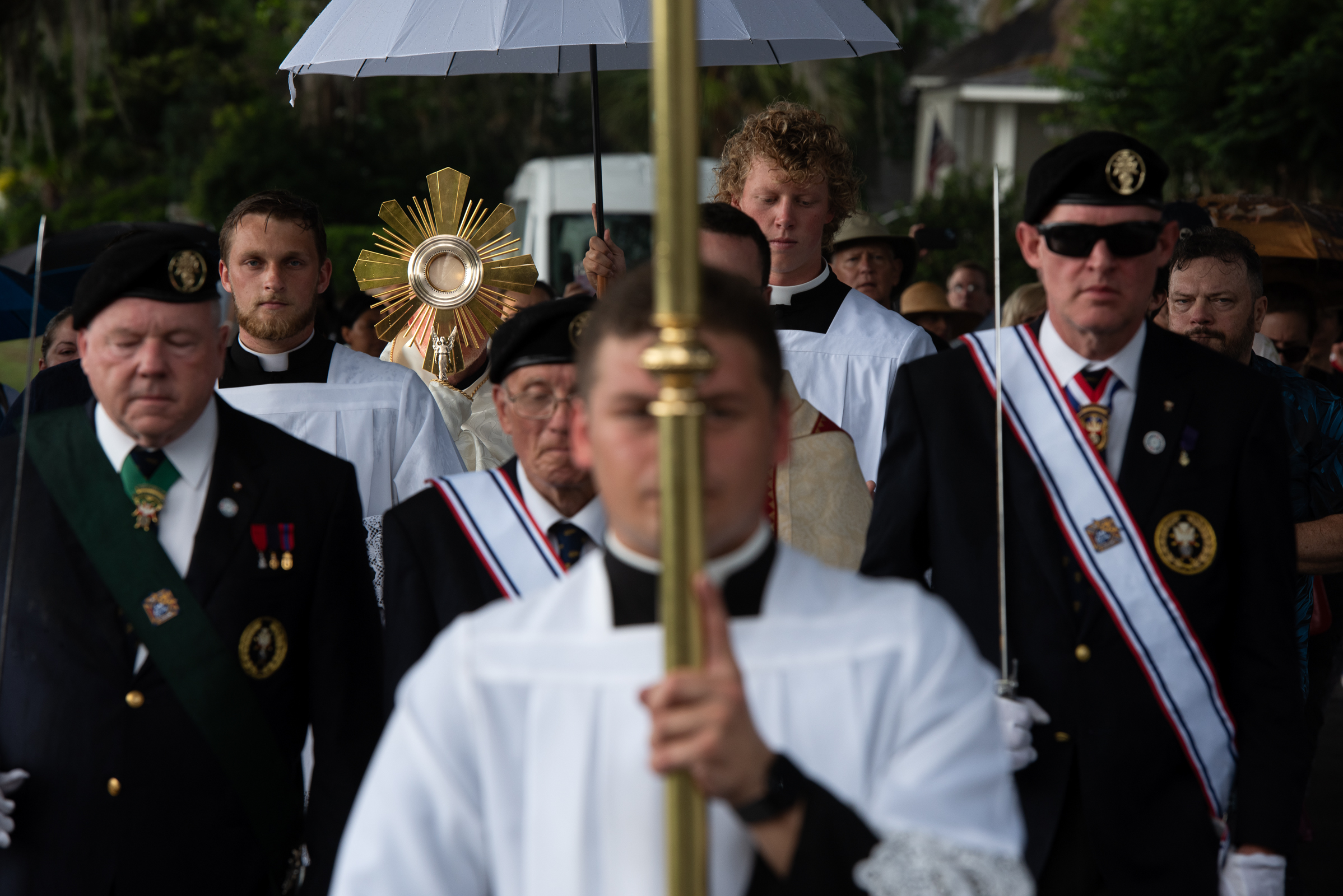 A Eucharistic procession moves through a Savannah neighborhood during rainfall on May 26, 2026. | Credit: Jeffrey Bruno