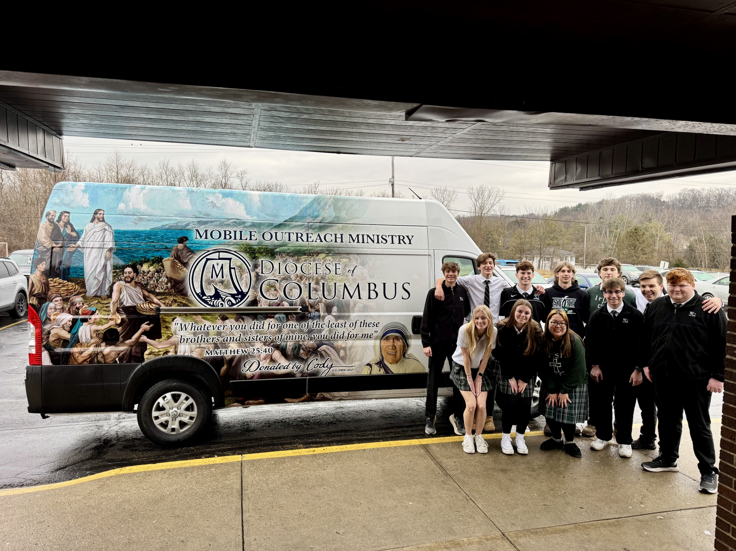 Students from Fisher Catholic High School in Lancaster, Ohio, stand outside the mobile outreach ministry van. | Credit: Photo courtesy of Deacon Matt Shaw