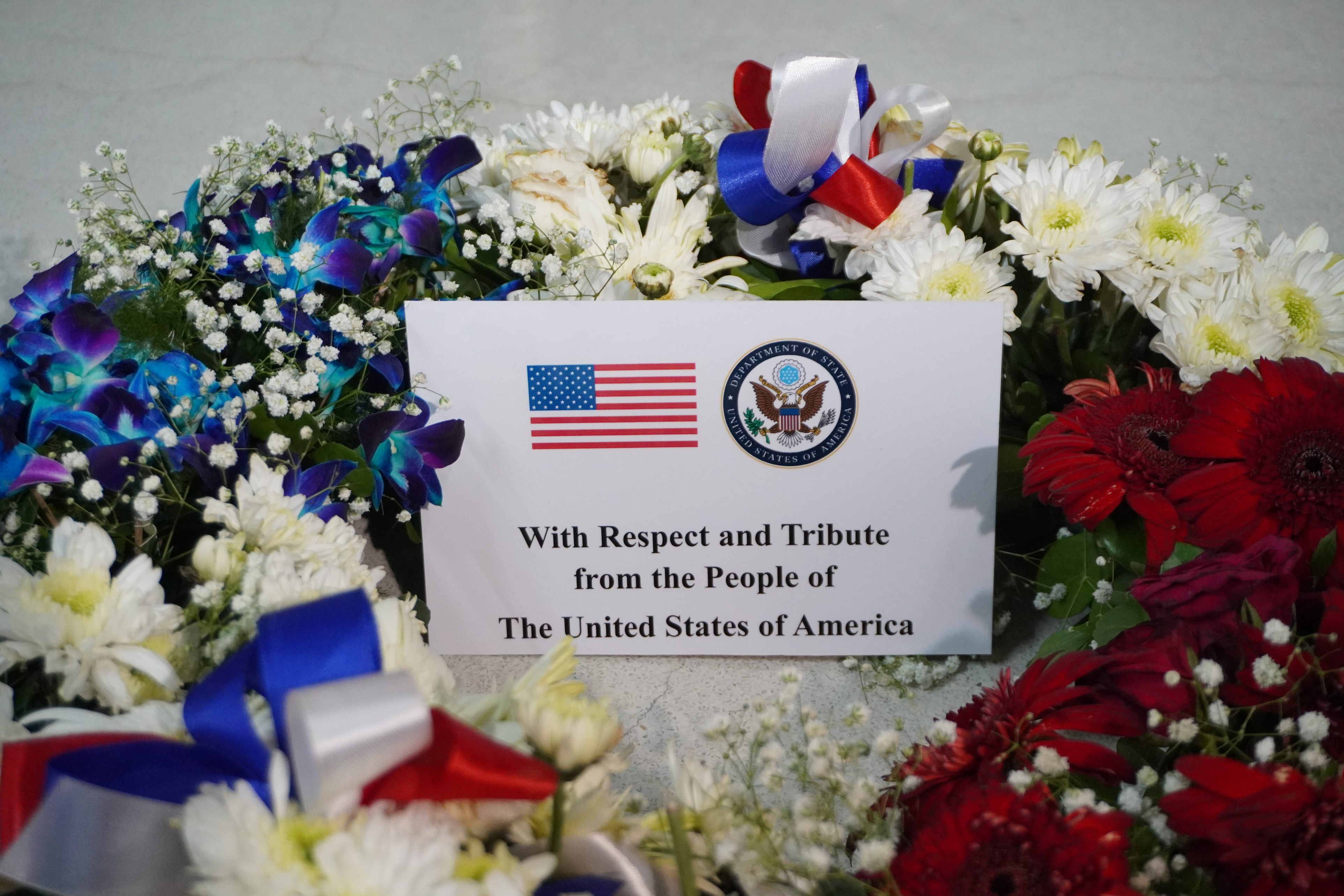 A wreath from U.S. Secretary of State Marco Rubio bears a card from the U.S. Department of State reading “With Respect and Tribute from the People of The United States of America” at the tomb of St. Teresa of Kolkata on May 23, 2026. | Credit: Anto Akkara