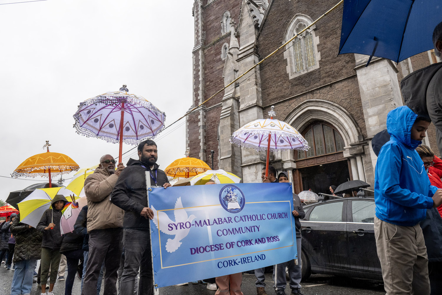 The 100th Eucharistic procession in Cork drew 5,000 people on June 7, 2026, as the Eucharist was carried along the route followed by throngs of faithful under canopies and umbrellas. | Credit: Brian Lougheed