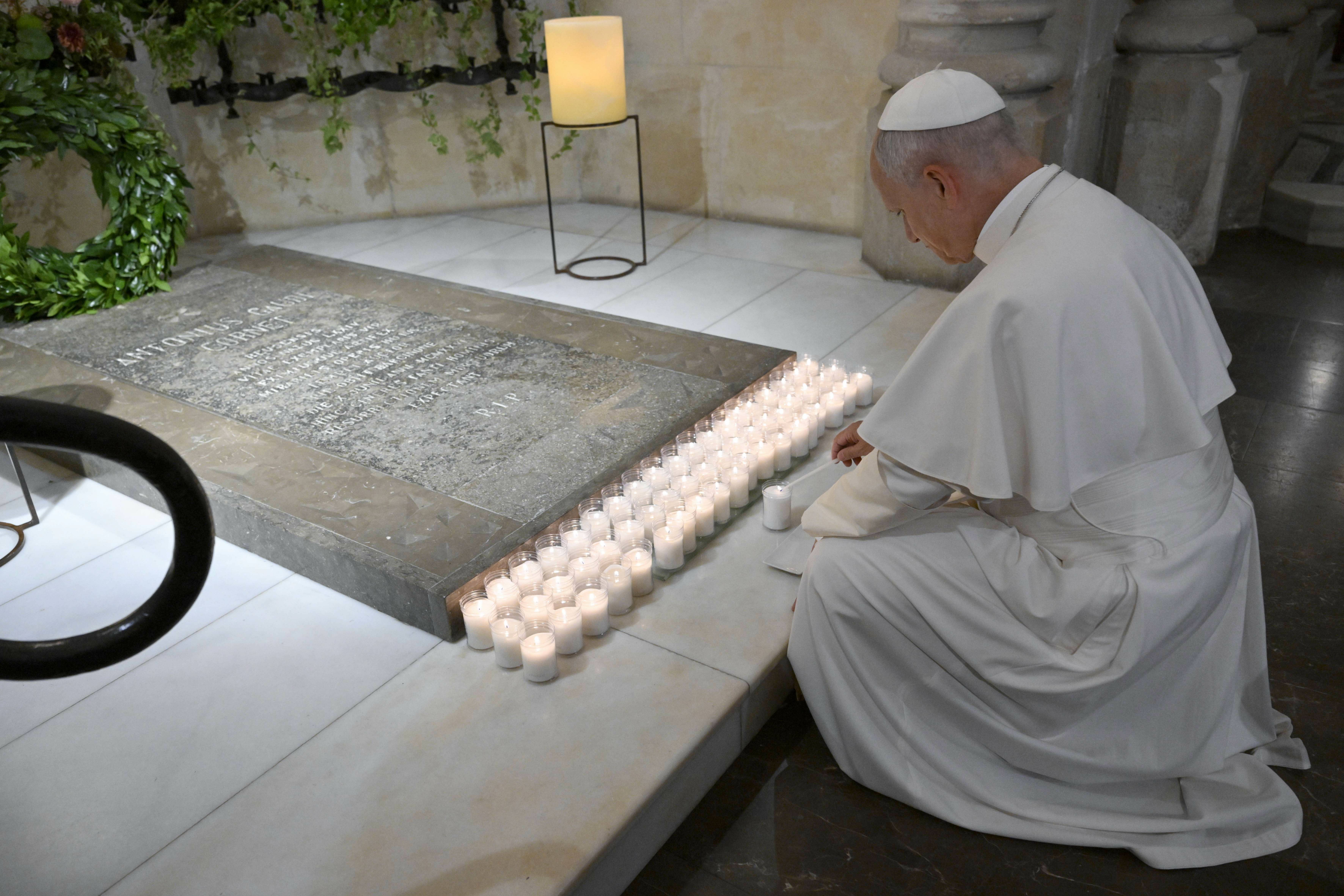 Pope Leo XIV lights a candle before the tomb of Venerable Antoni Gaudí on June 10, 2026. | Credit: Vatican Media
