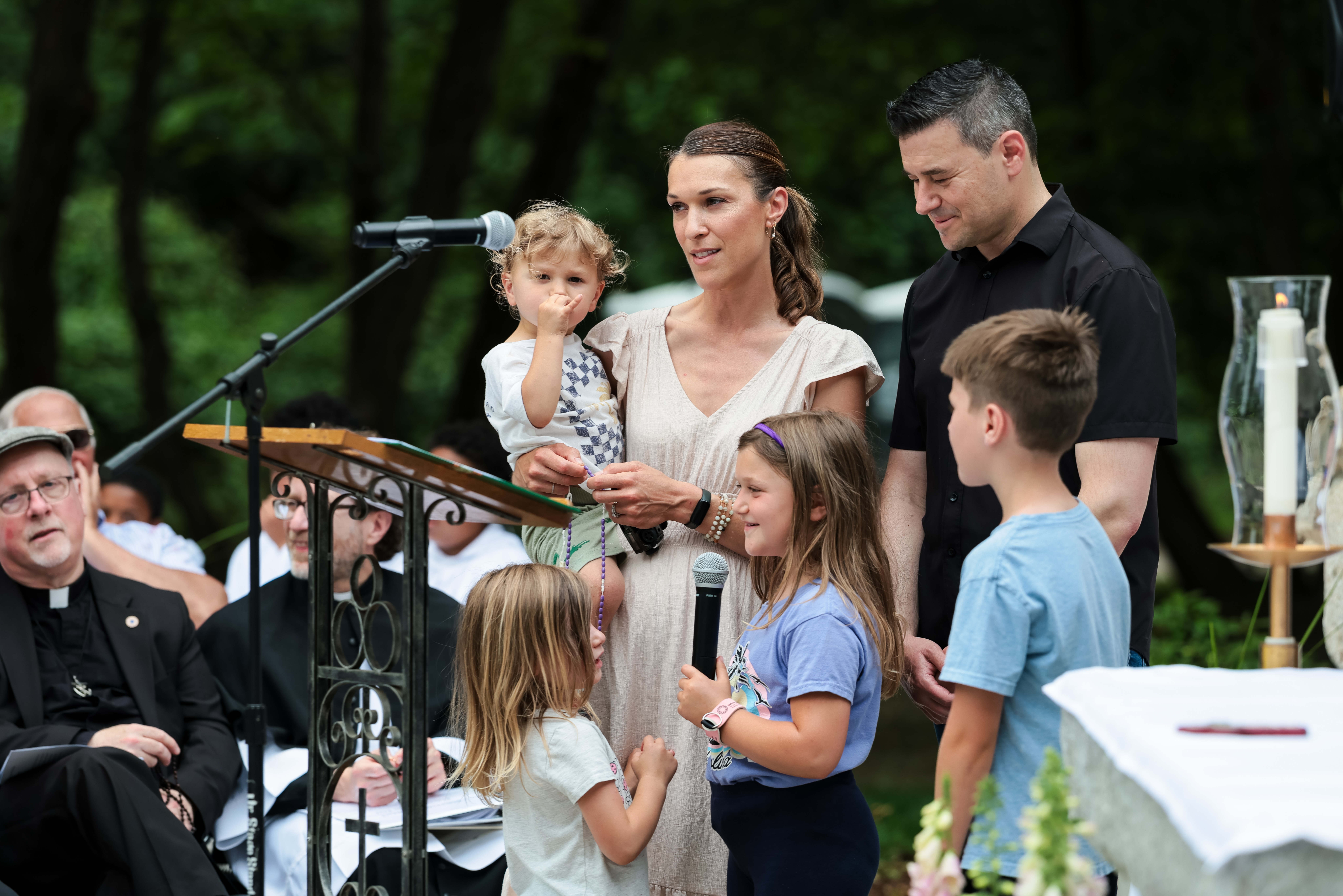 A family leads a decade of the rosary at the reopening of the Father Peyton Center. | Credit: Photo courtesy of Holy Cross Family Ministries