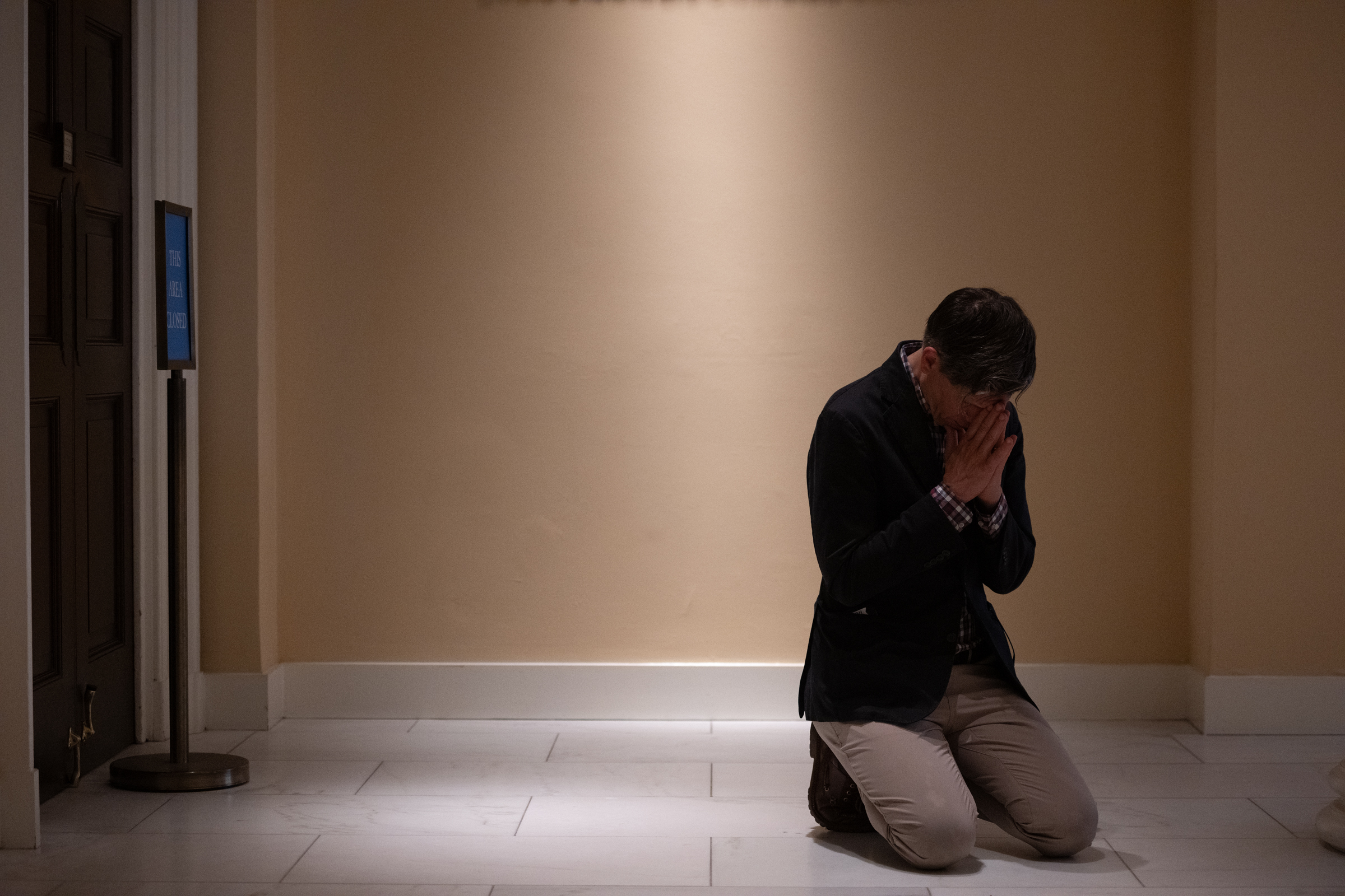 A member of the congregation kneels in prayer during Mass at the Basilica of the National Shrine of the Assumption of the Blessed Virgin Mary during the National Eucharistic Pilgrimage in Baltimore, Maryland, June 10, 2026. | Credit: Jeffrey Bruno/EWTN News