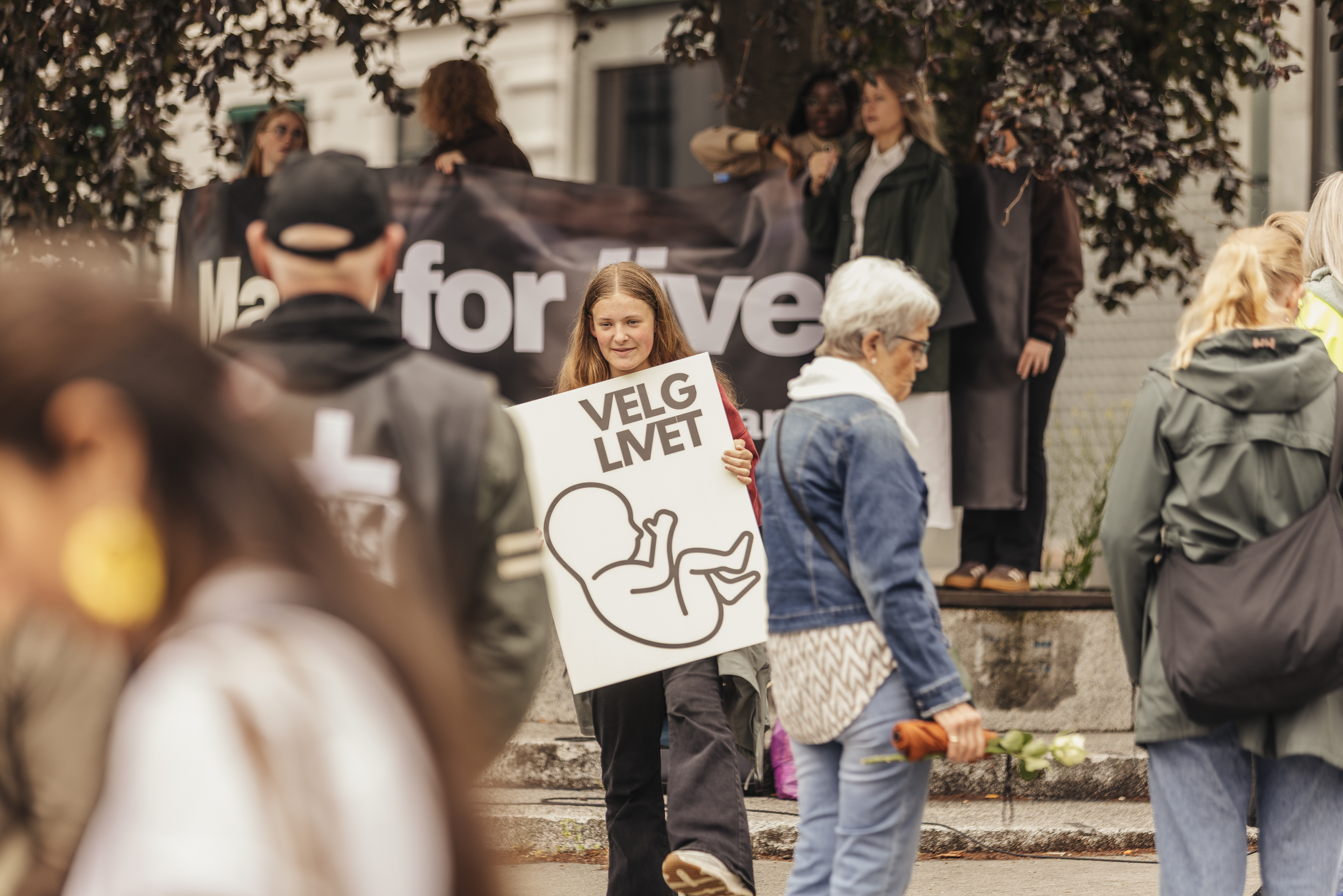 A young participant carries a “Velg Livet” (“Choose Life”) placard during the March for Life in Oslo, Norway, on June 13, 2026. | Credit: Bendik Bruun Edvardsen