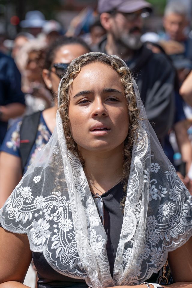 A Catholic prays during a Eucharistic procession in Boston, June 27, 2026. The event was part of the National Eucharistic Pilgrimage taking place up and down the East Coast. | Credit: Bryce Vickmark