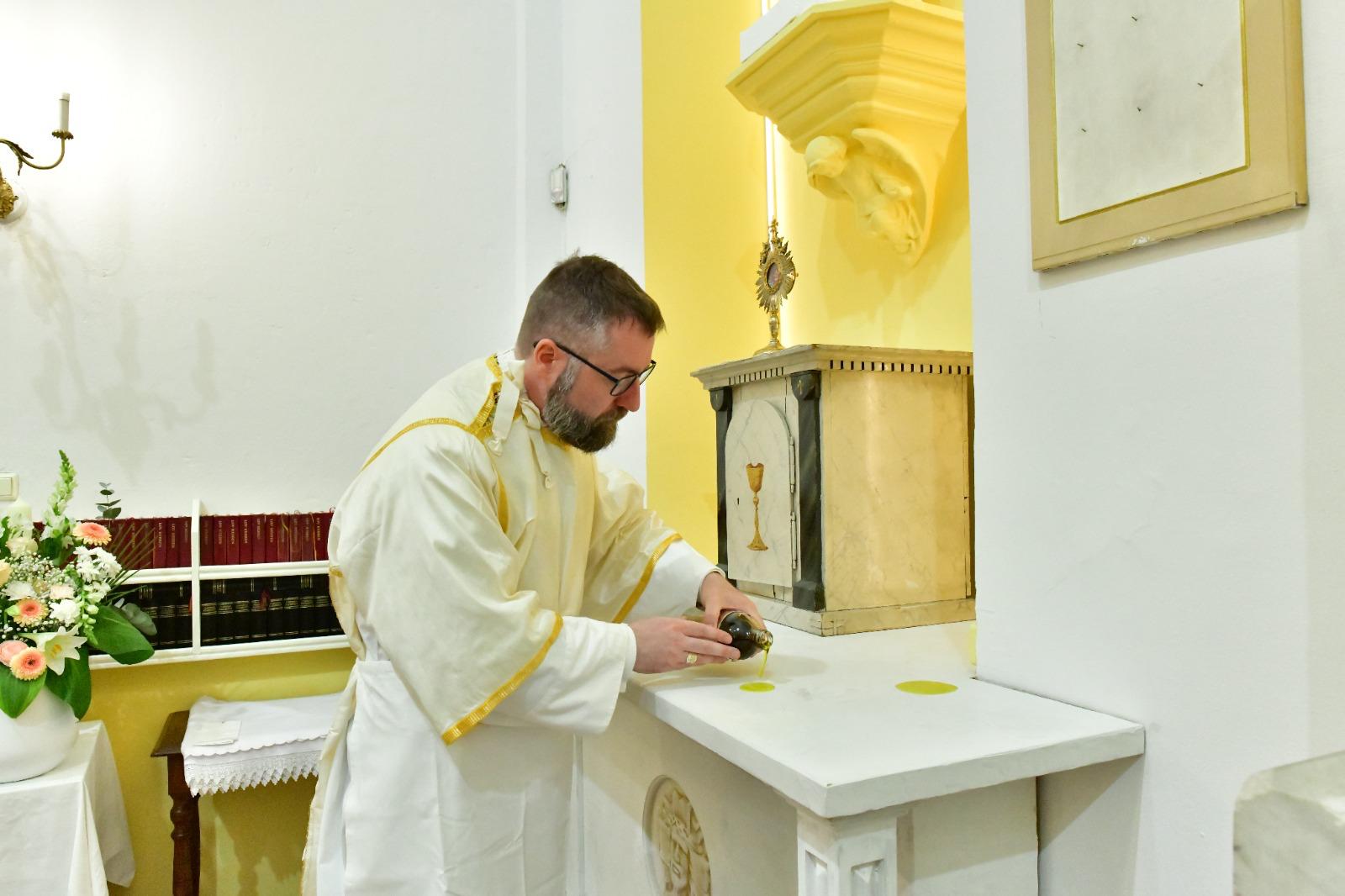 Bishop Fredrik Hansen anoints the altar with sacred chrism during the consecration of St. Paul’s Church in Bergen, Norway, on June 28, 2026. | Credit: Hoang Van Nguyen