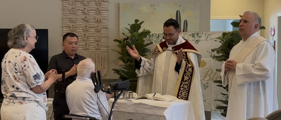 Father Edson Elizarraras, pastor of St. Christopher Parish in Marana, Arizona, celebrates Mass at 98-year-old Raymond Martin’s baptism, confirmation, and first Communion on July 16, 2026. | Credit: Photo courtesy of Deacon Jack Trevino