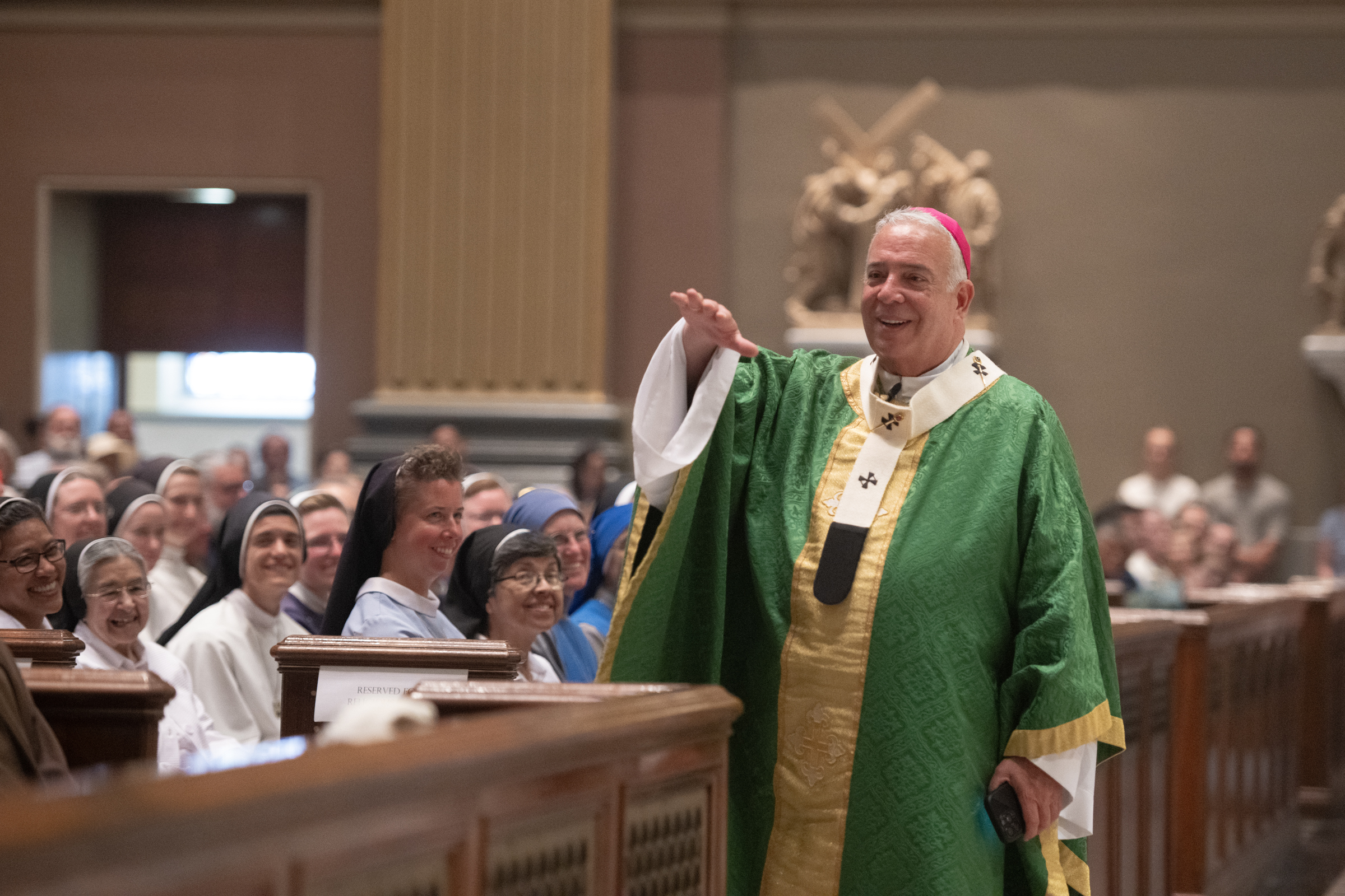 Archbishop Nelson J. Pérez gestures to worshippers as religious sisters look on during the closing Mass of the 2026 National Eucharistic Pilgrimage in Philadelphia, Sunday, July 5, 2026. | Credit: Jeffrey Bruno