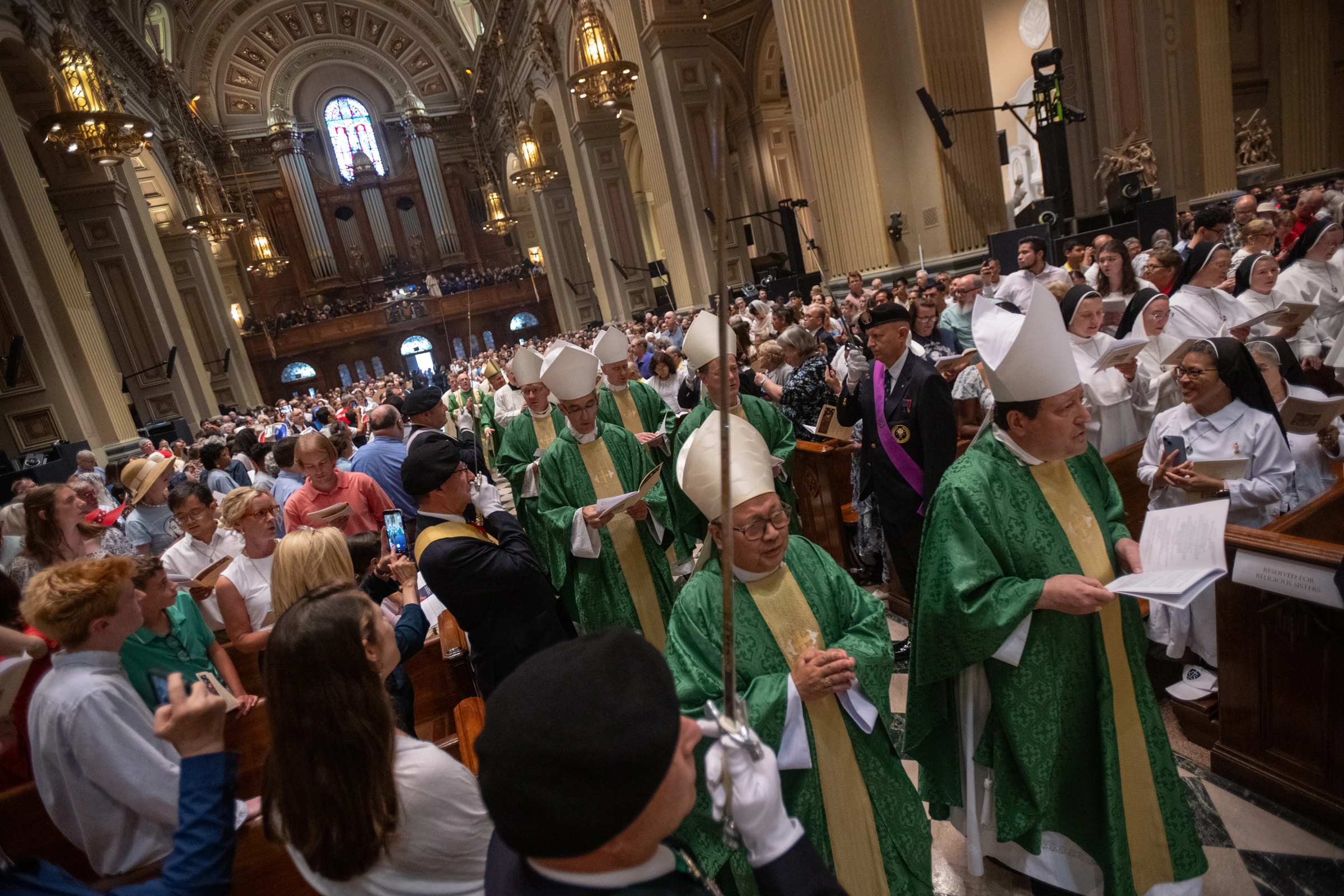 Bishops and clergy process through the packed cathedral during the entrance procession for the closing Mass of the 2026 National Eucharistic Pilgrimage in Philadelphia, Sunday, July 5, 2026. | Credit: Jeffrey Bruno