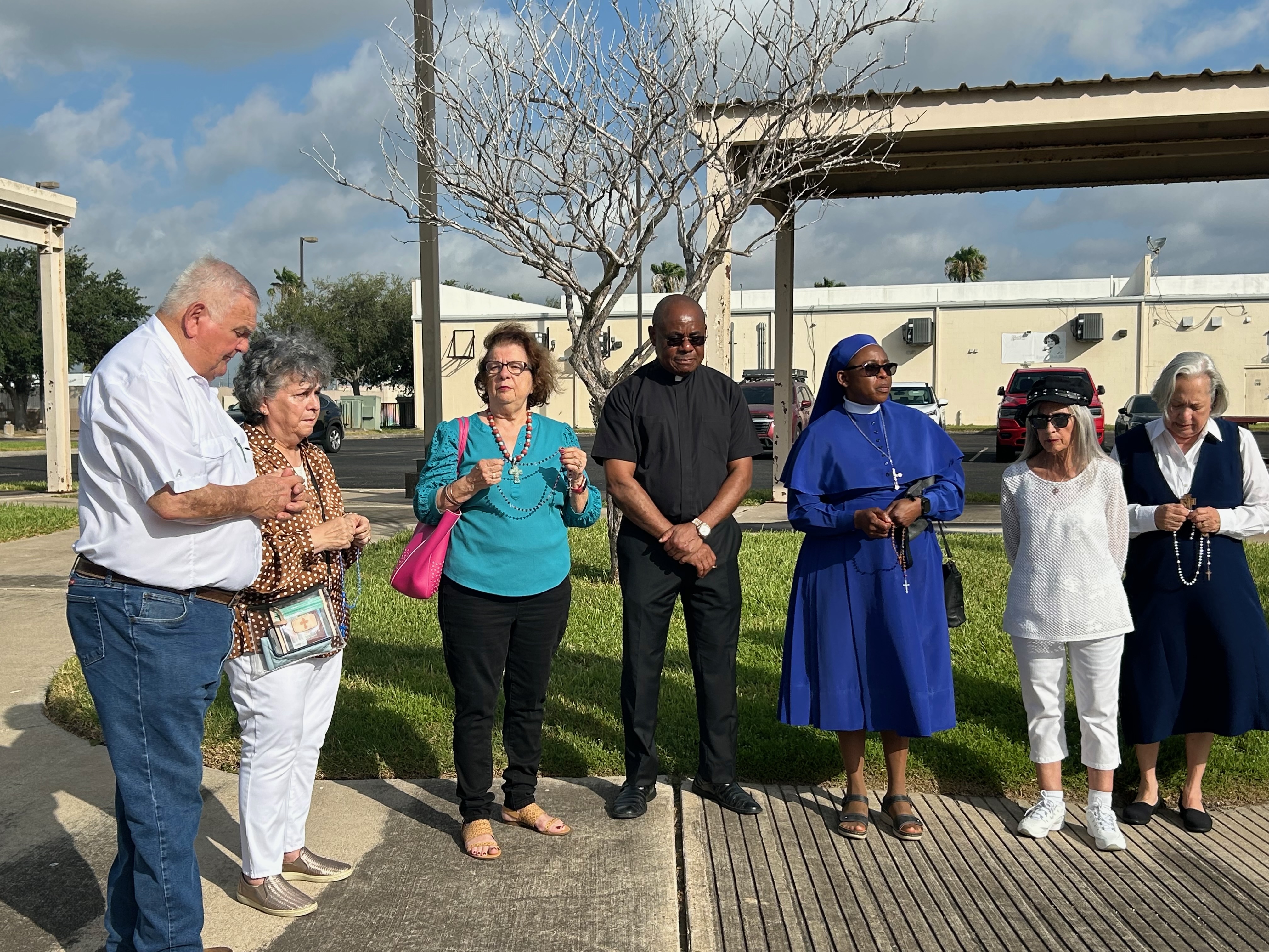 Supporters of Sister Leticia Ugboaja, including Sister Norma Pimentel, right, pray the rosary outside an ICE field office in Harlingen, Texas, as they await news of Ugboaja’s immigration case, July 28, 2026. | Credit: Amira Abuzeid/EWTN News
