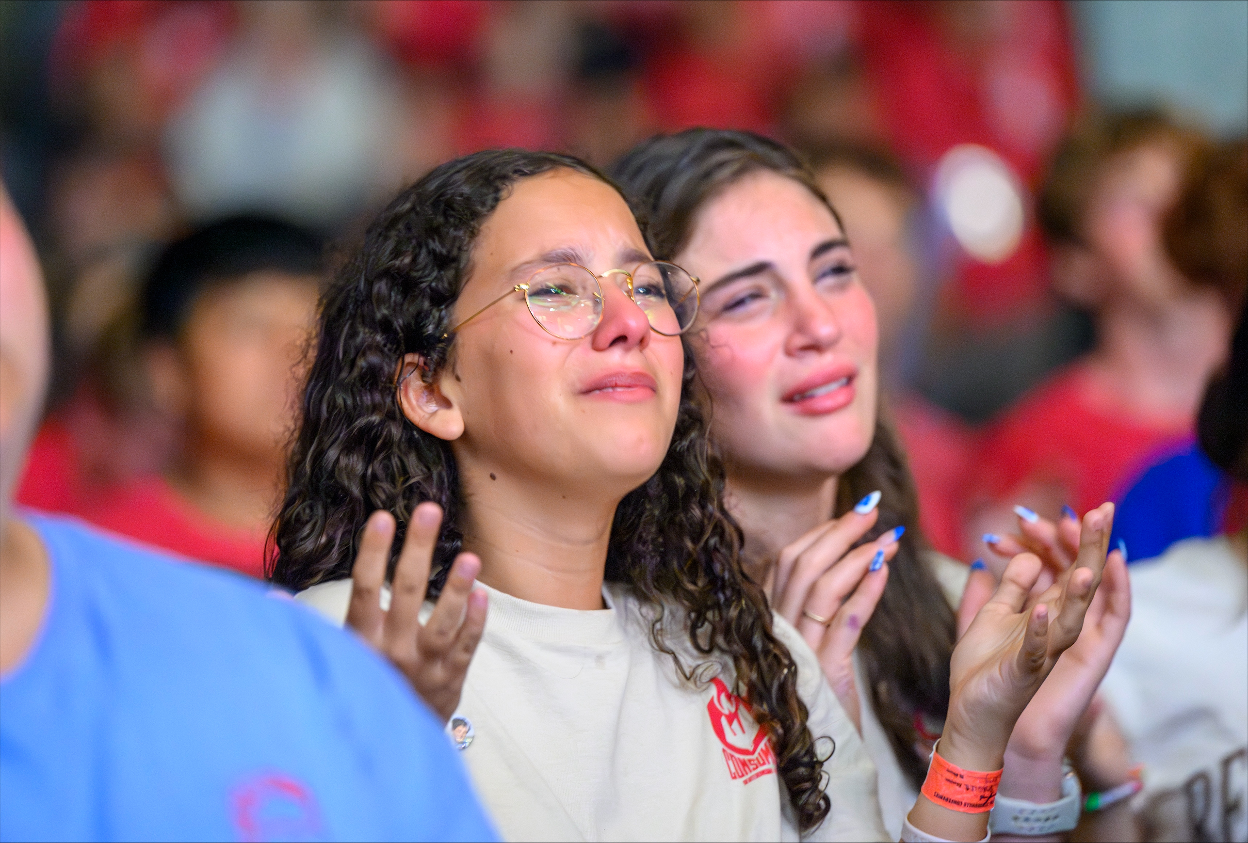 Two young women are visibly emotional during worship at a Steubenville Youth Conference. | Credit: Franciscan University of Steubenville