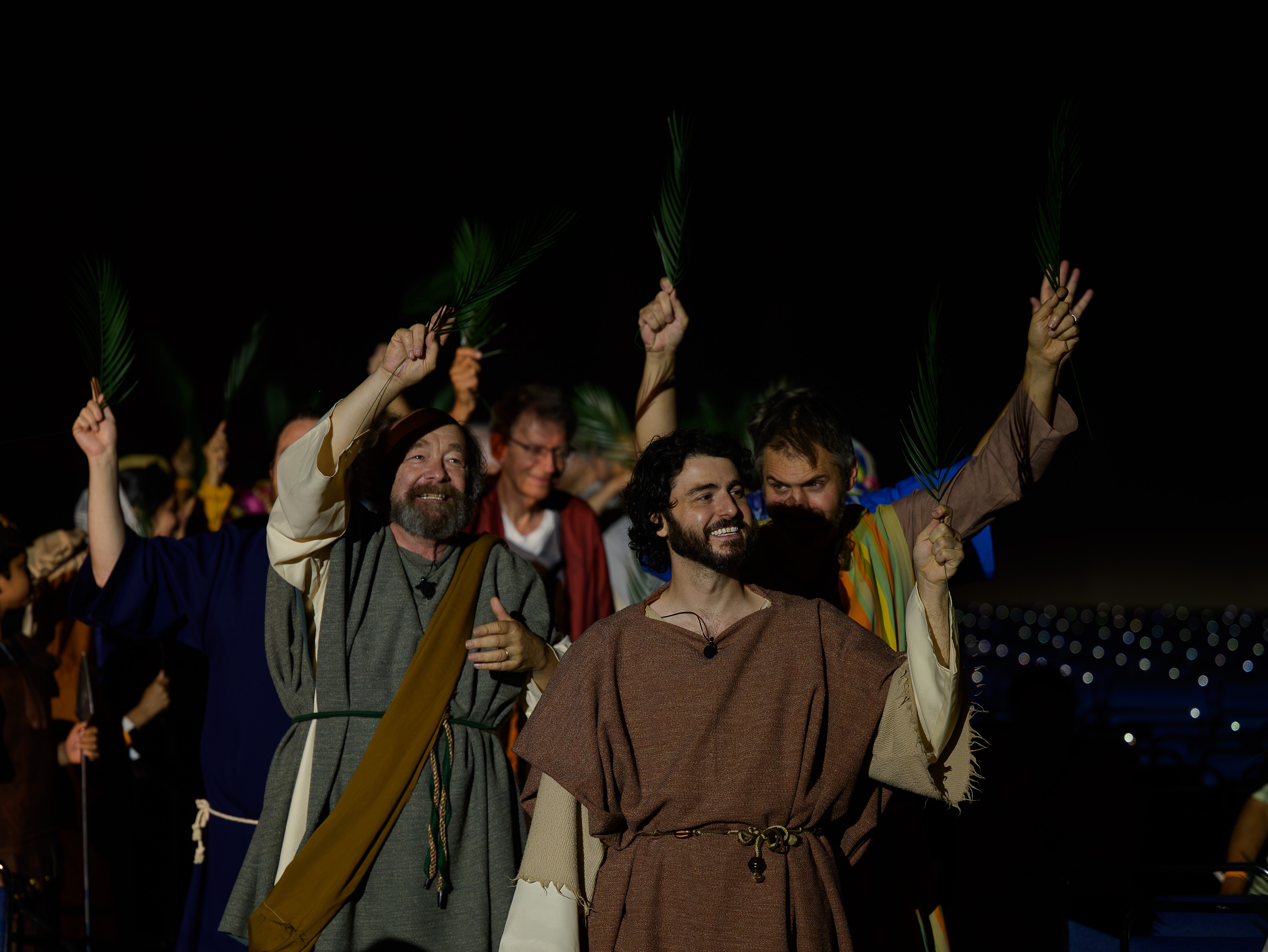 Men in biblical garb hold palm branches in a scene from one of the plays about the life of Jesus performed at Syro26, held July 9–12, 2026, in Chicago. | Credit: Jitto Kurian