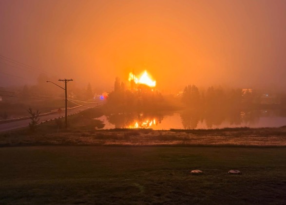 Saint-Simon Catholic Church burns in a massive blaze on Aug. 24, 2026, in Caraquet, New Brunswick, Canada. A 68-year-old man was arrested on charges of arson related to the fire. | Credit: Monica Albert Légère