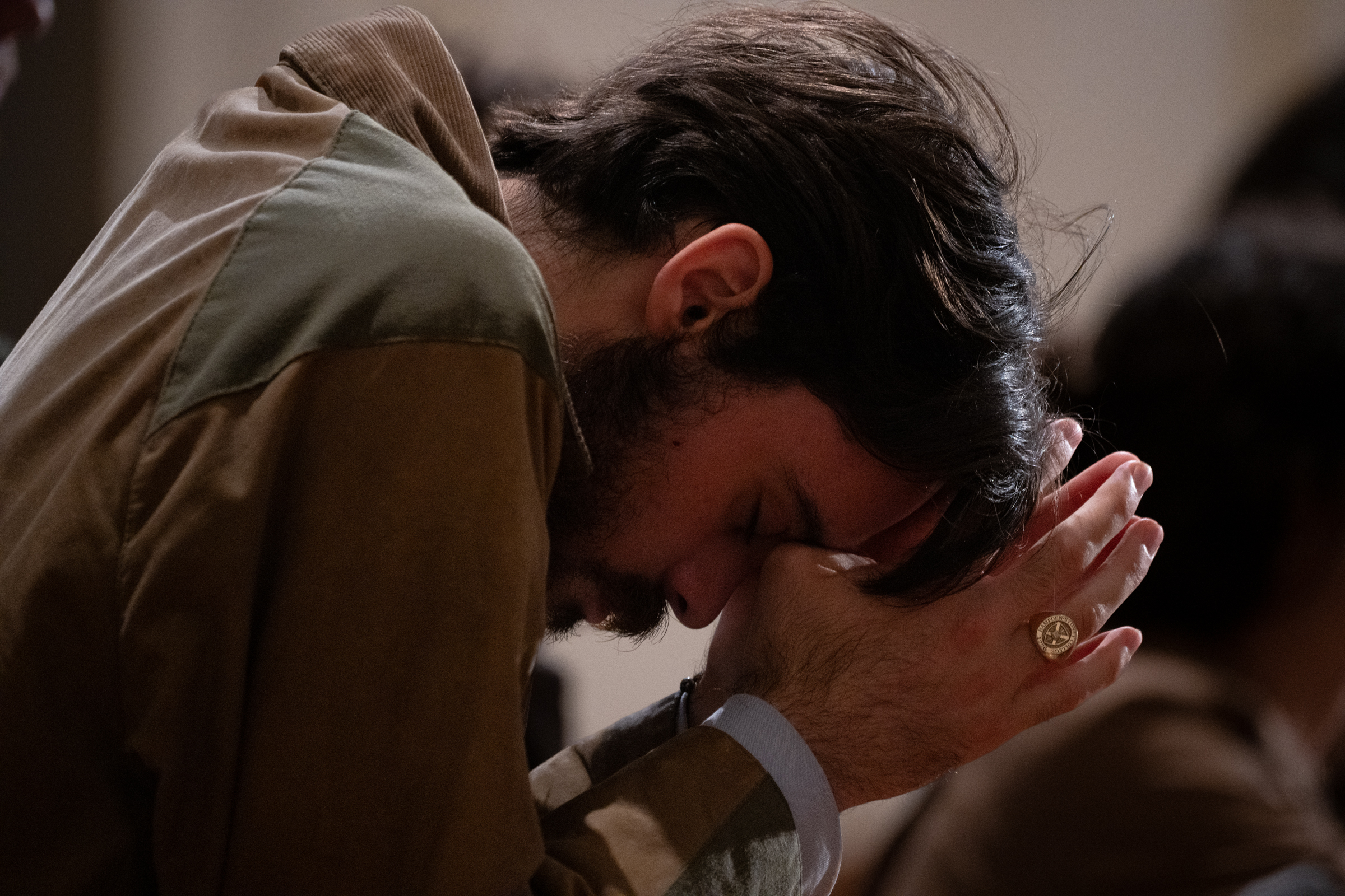 A man bows his head over clasped hands while seated in the church at the Basilica of the National Shrine of the Immaculate Conception in Washington, D.C., for the Dominican Rosary Pilgrimage on Saturday, Sept. 26, 2026. | Credit: Jeffrey Bruno