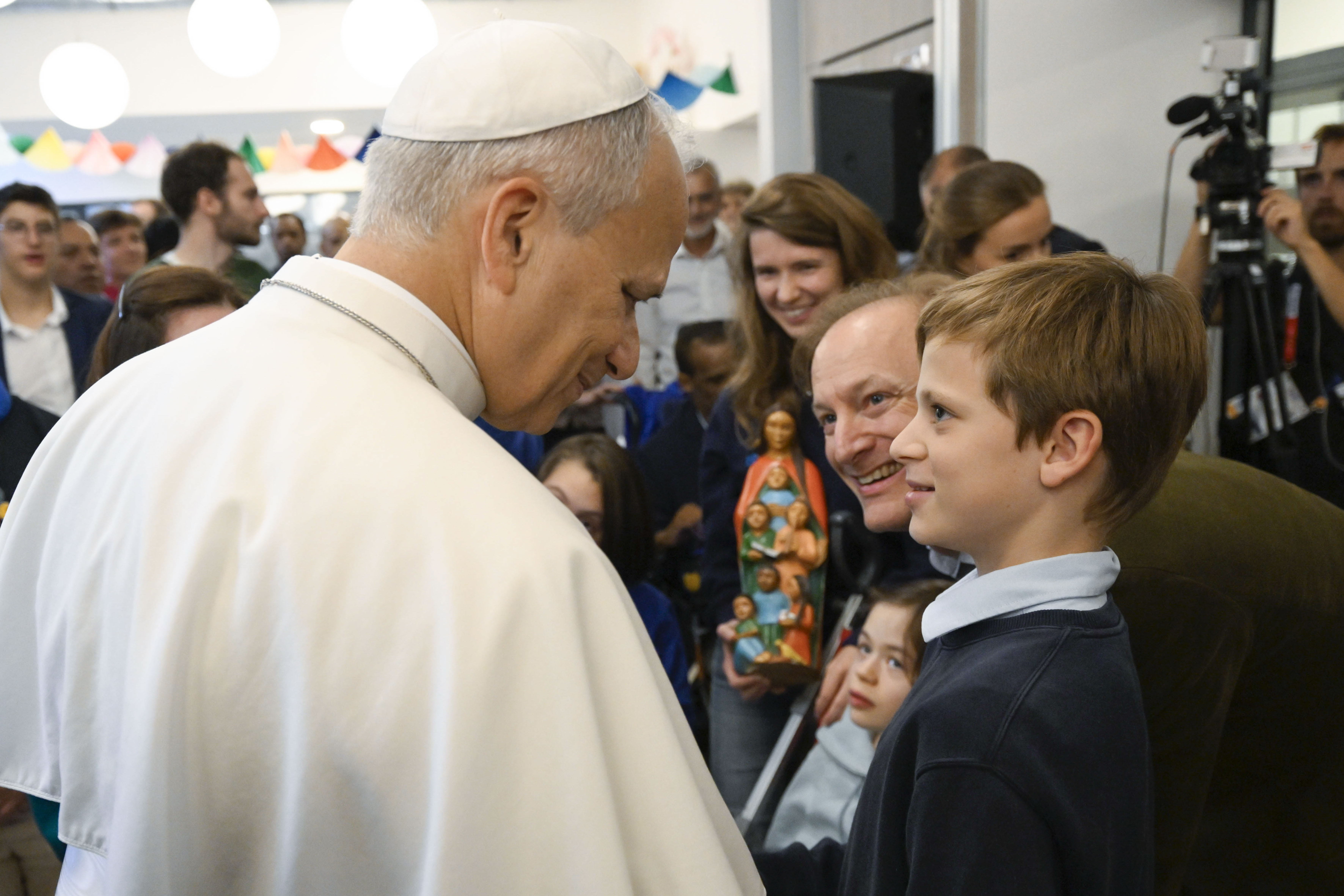 Pope Leo XIV greets the staff and volunteers of the Maison Bakhita Center for Social Support and Integration in Paris, France, on Sept. 26, 2026. | Credit: Vatican Media