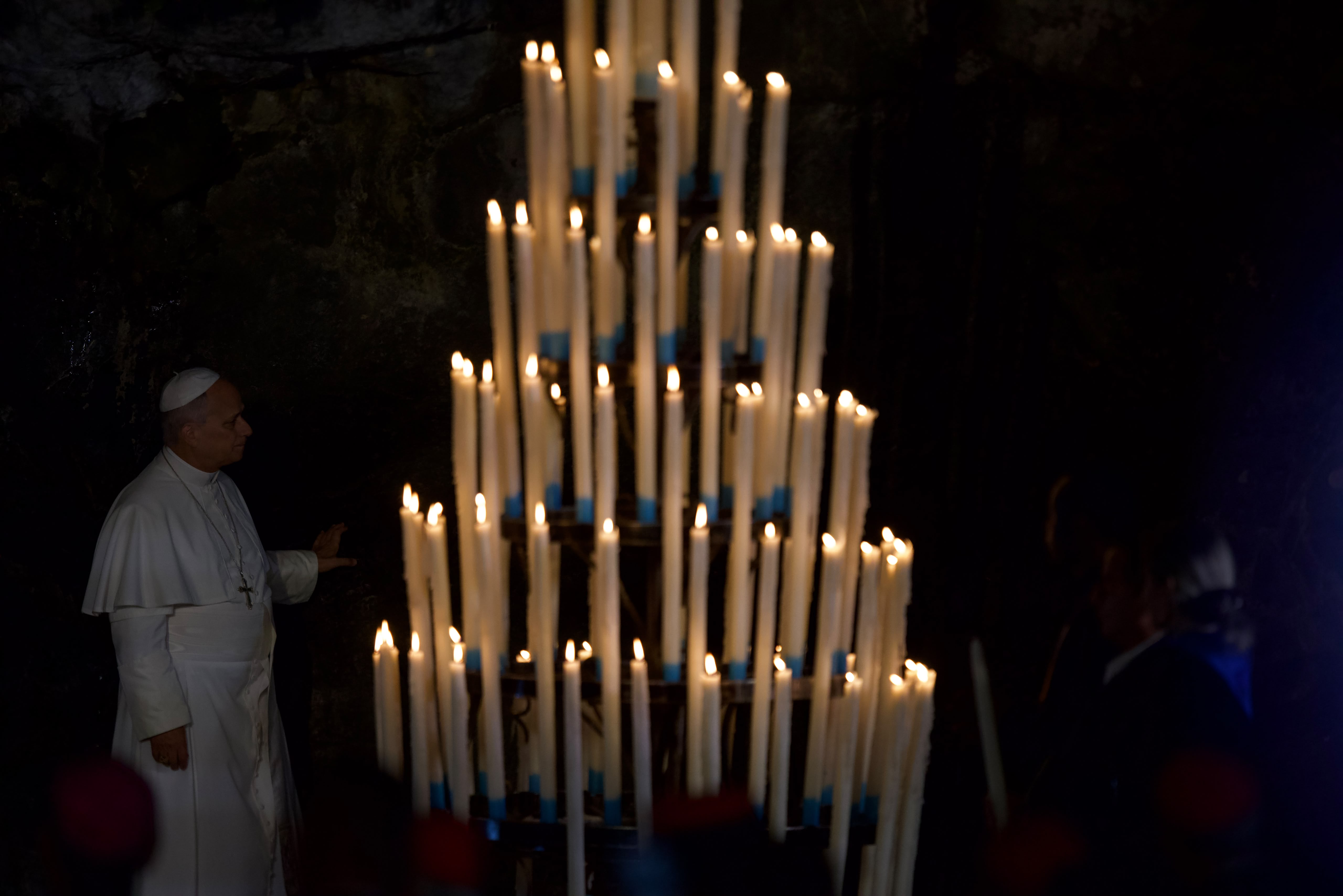 Pope Leo XIV touches the rock at the grotto in the Shrine of Our Lady of Lourdes on Sept. 26, 2026, in France. | Credit: Daniel Ibáñez/EWTN News