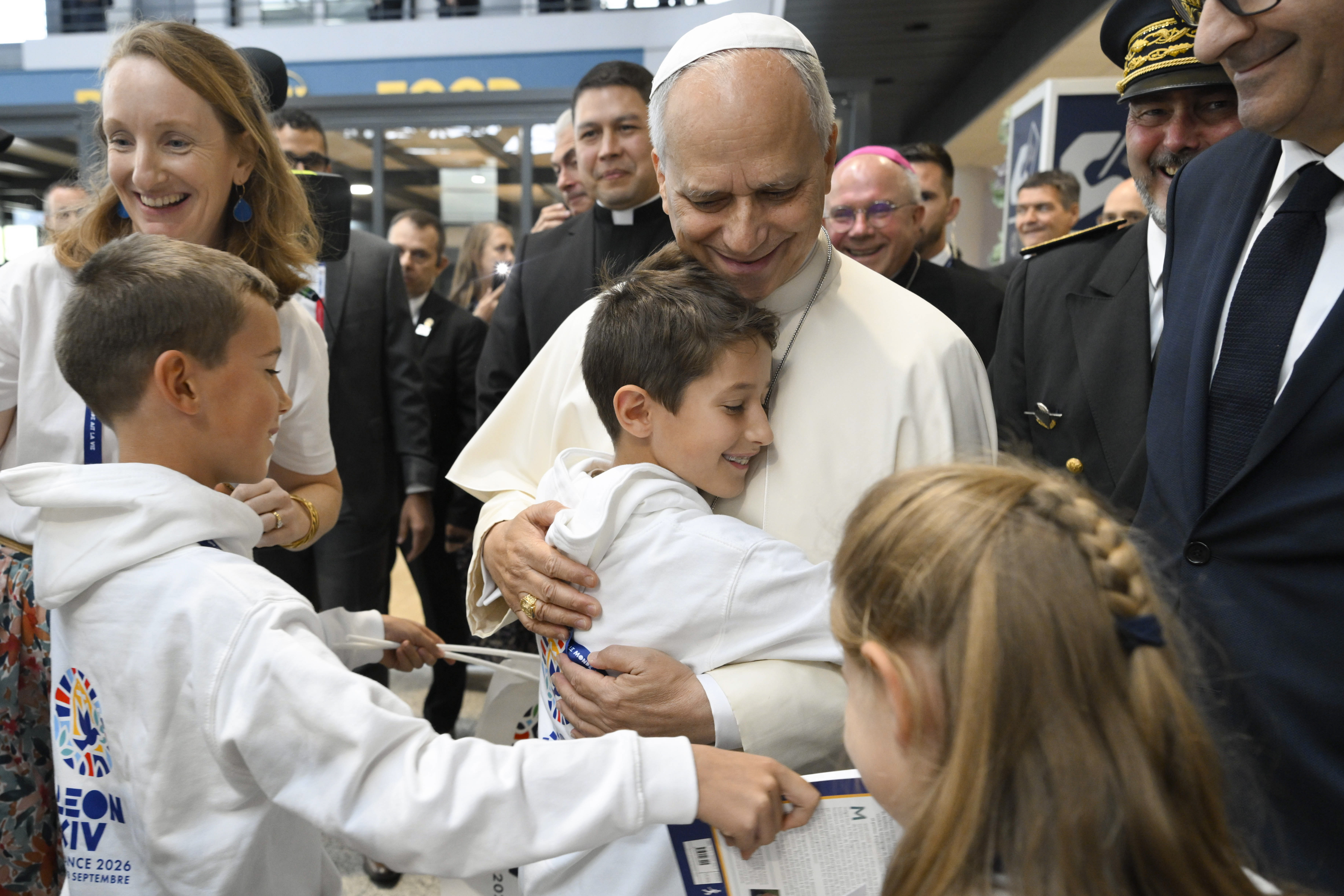 Pope Leo XIV embraces a child after landing in Metz, France, on Sept. 28, 2026. | Credit: Vatican Media