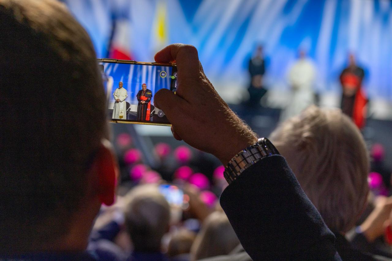 A participant takes a video recording of Pope Leo XIV’s participation at the meeting “To the Roots of Europe for Peace and Unity” at the Robert Schuman Conference Center in Metz, France, on Sept. 28, 2026. | Credit: Daniel Ibáñez/EWTN News