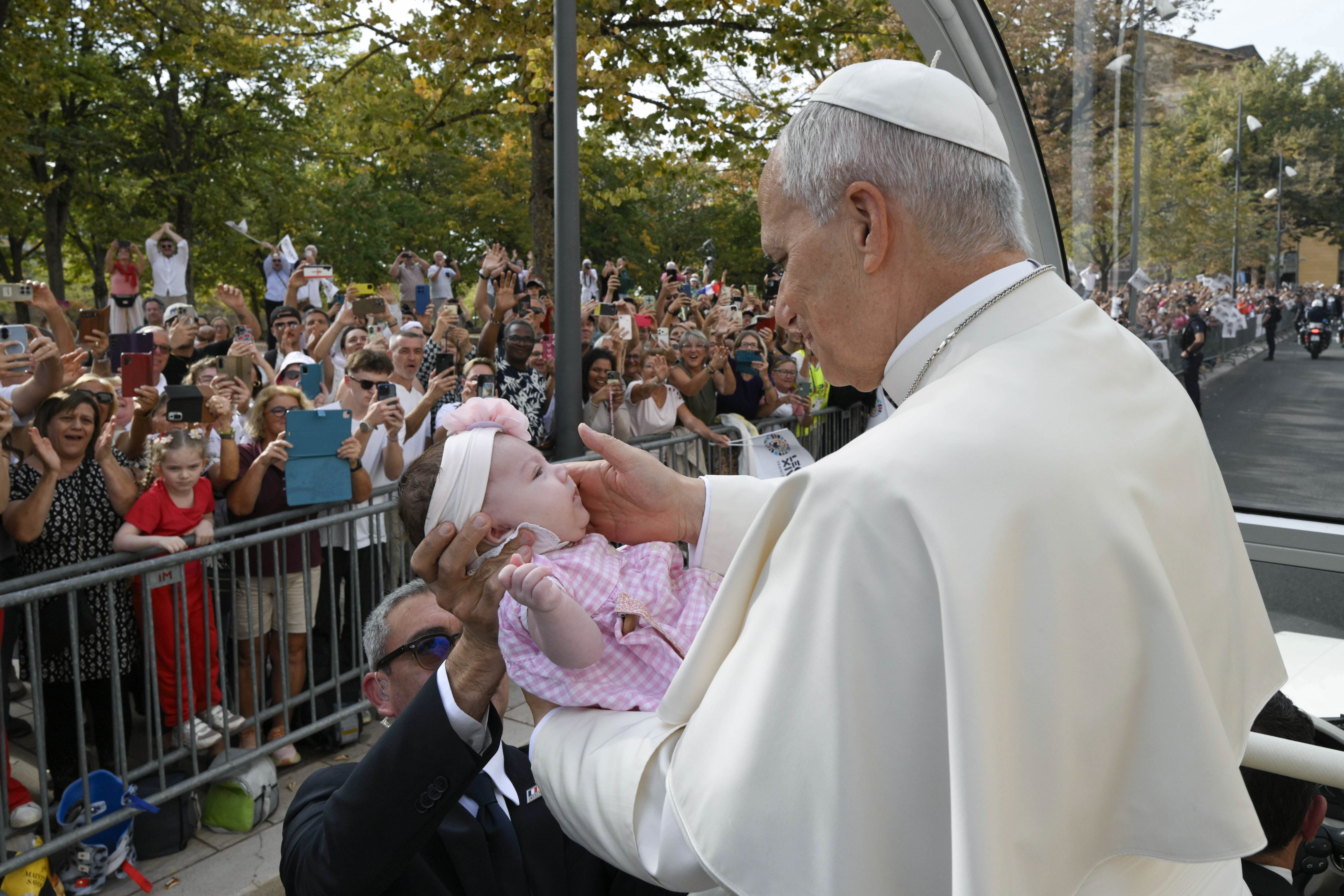 Pope Leo XIV stops to bless a baby as he makes his way to the Cathedral of St. Stephen on Sept. 28, 2026, in Metz, France. | Credit: Vatican Media