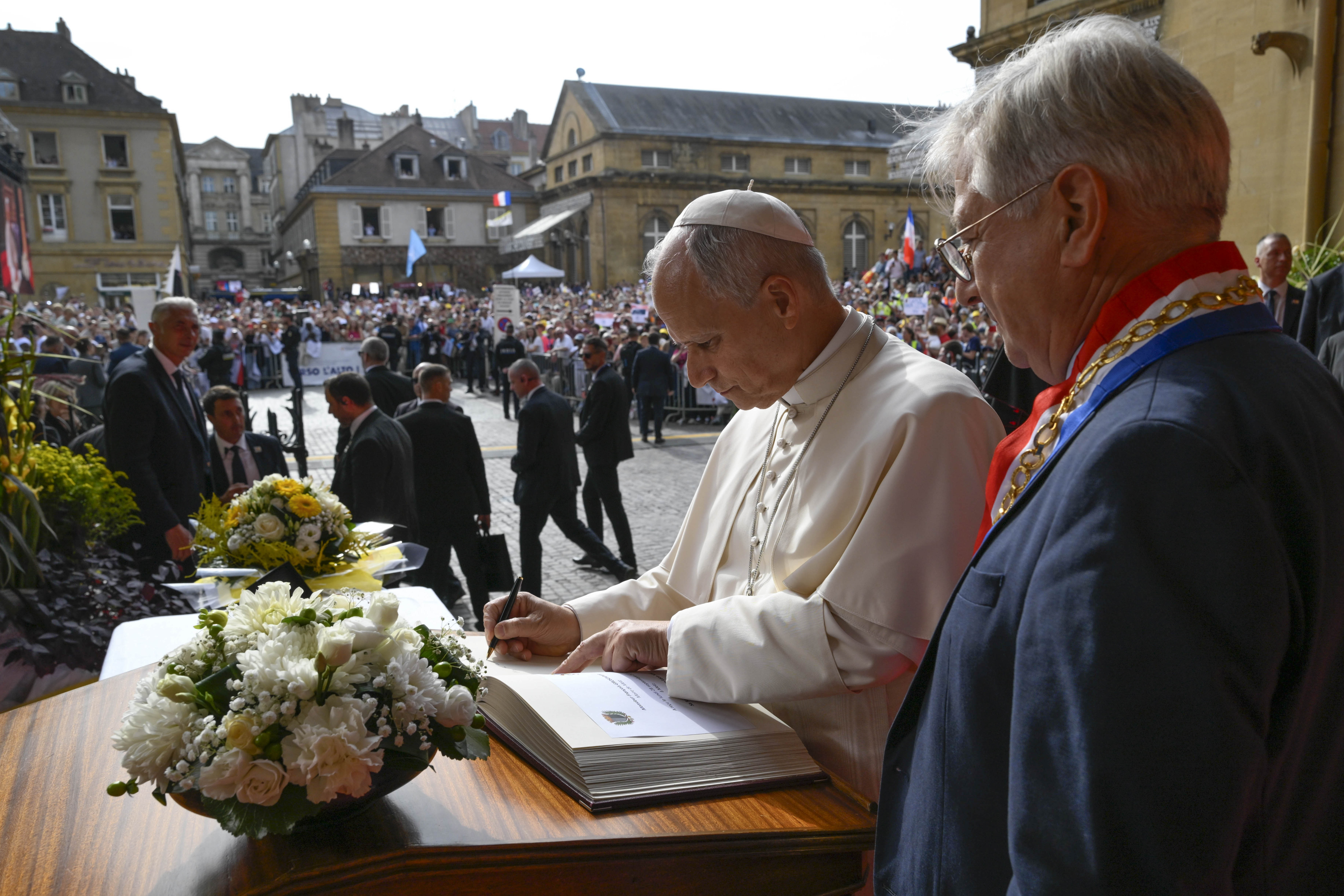 Pope Leo XIV signs the guest book upon entering the Cathedral of St. Stephen on Sept. 28, 2026, in Metz, France. | Credit: Vatican Media