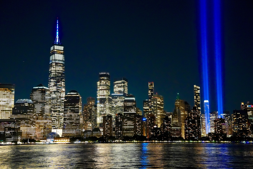 The Tribute in Light annual 9/11 memorial’s twin shafts of light soar skyward over Manhattan’s skyscrapers in 2025. | Credit: George Wirt/Shutterstock