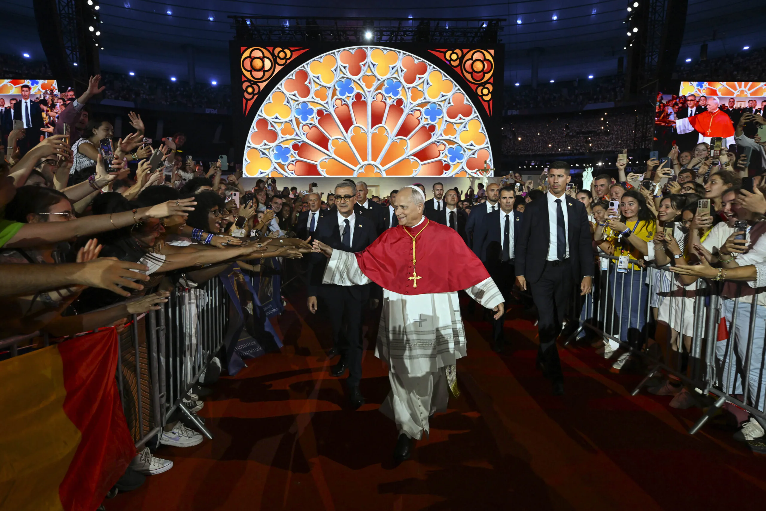 Thousands of young French Catholics converge on soccer stadium for prayer with Pope Leo