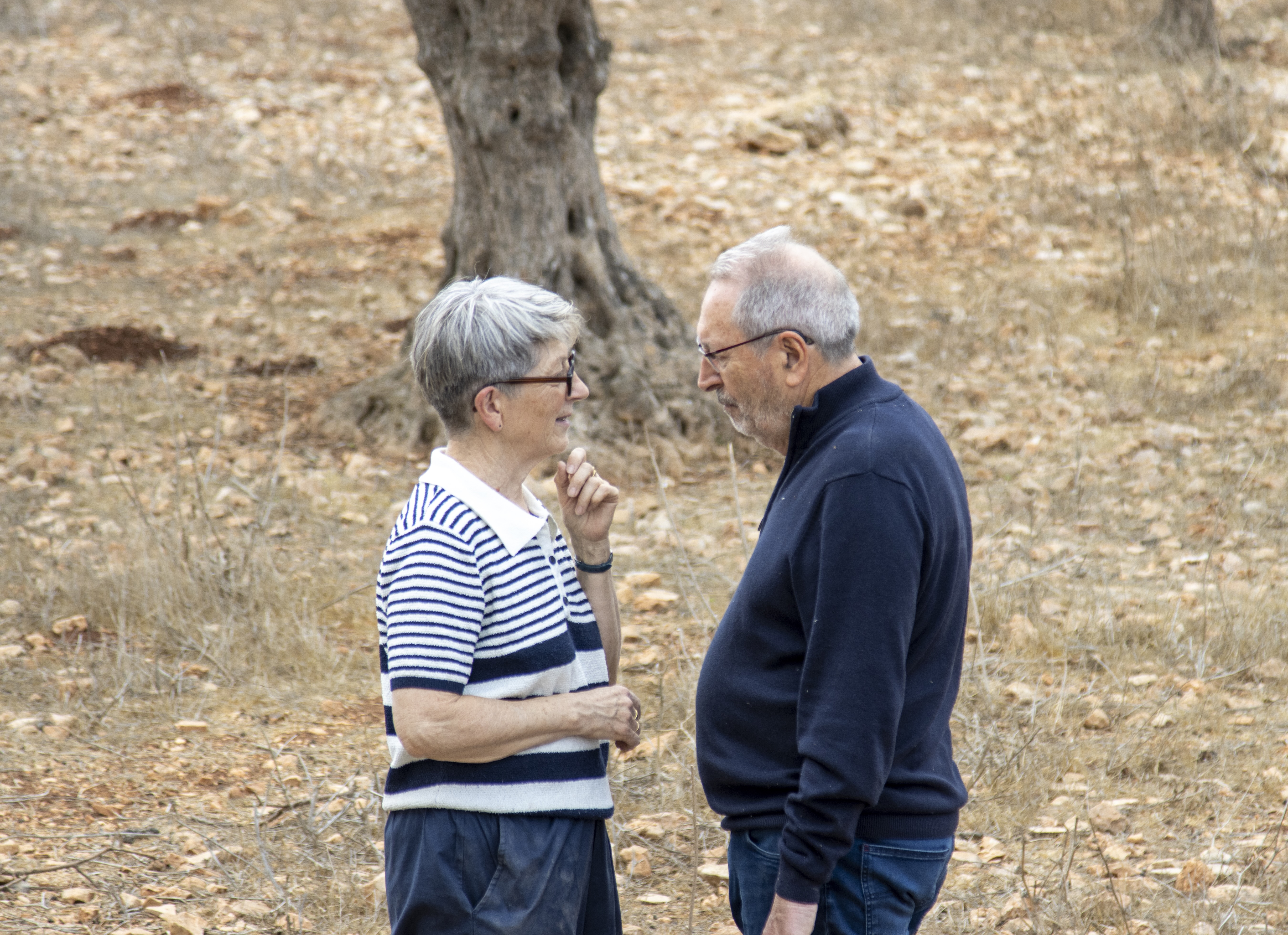 Bernard Baudoux, mayor of Aulnoye-Aymeries, France, with his wife on farmland in Taybeh before he was assaulted by settlers. | Credit: Sanad Sahelia