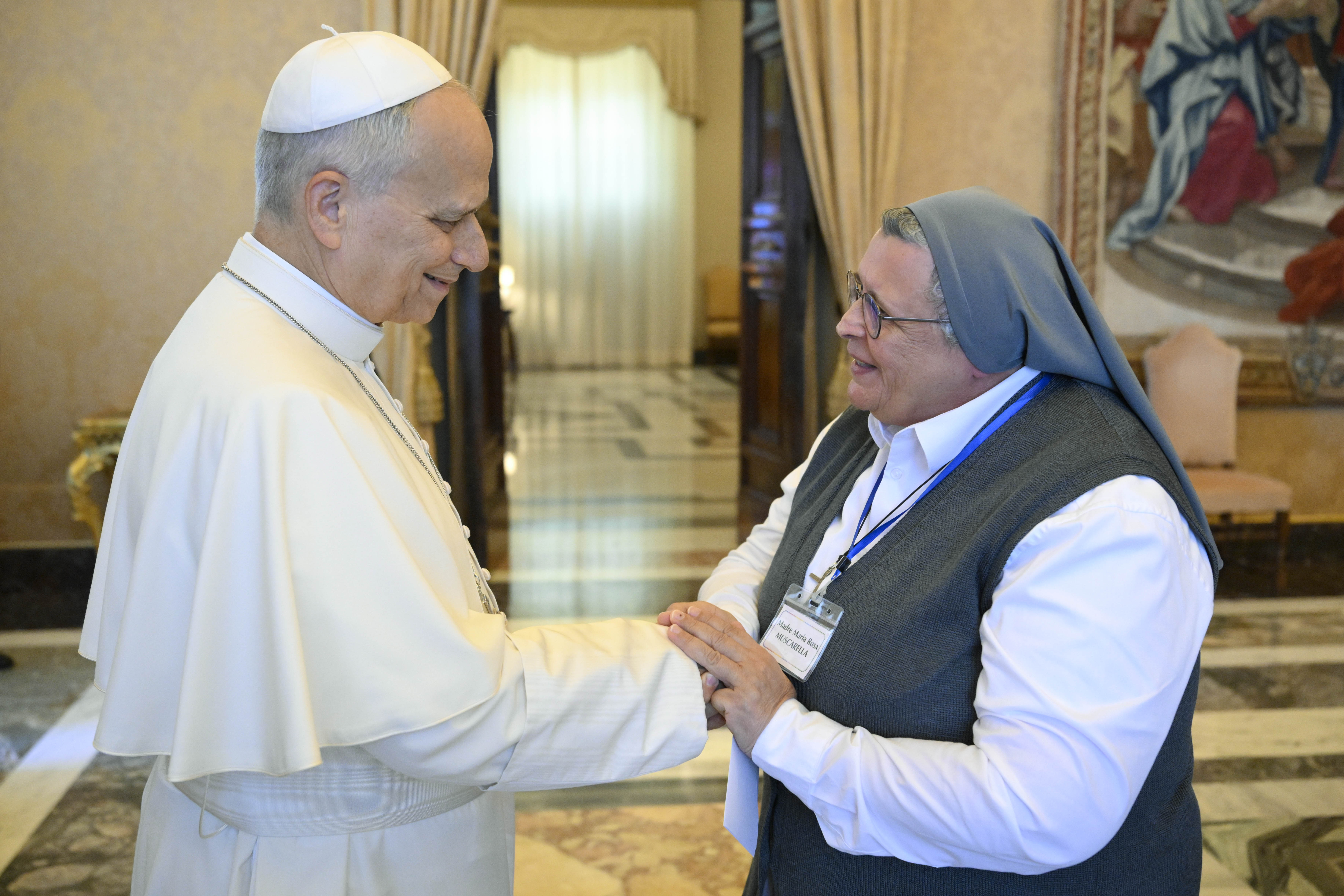 Pope Leo XIV greets a member of the Sisters of Charity of Saint Jeanne-Antide Thouret after his private audience with the community at the Apostolic Palace in the Vatican on Oct. 26, 2026. | Credit: Vatican Media